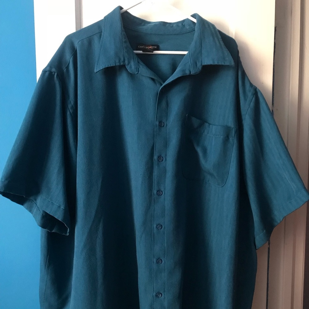 This is a short sleeve shirt. Blue in color.